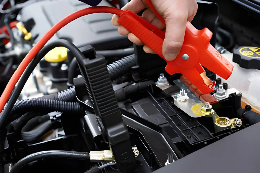 Professional jump start service being performed on a car battery by Car Jump Start Bros in Atherton.